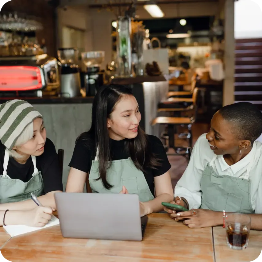 A venue's team working on a laptop